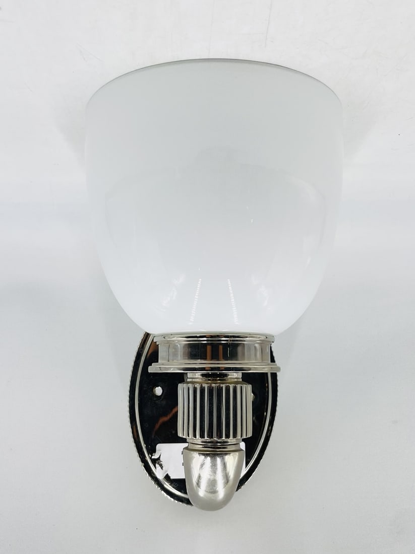 Wall Sconces with White Glass Shade & Nickel Arm: Wall sconce with a white glass shade and nickel arm. Removed from a Beverly Hills estate. Measurements: 10.50 inches high x 7 inches wide/shade diameter x 7.25 inches deep/projection from the wall. Al