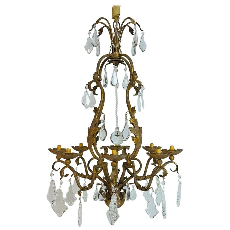Gilt Metal & Crystal Chandelier With Six Lights: Stunning chandelier dating from the 1970's, made in Italy. The body of the chandelier is made of steel covered in gold leaf and gold gilding, then adorned with beautiful crystal pendants. The piece co