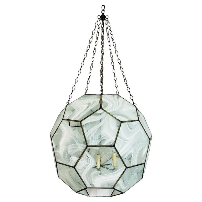 Honeycomb Chandelier by Clate Grunden 84"H X 30"Diameter: Stunning chandelier designed and manufactured in the United States by Clate Grunden. The chandelier features a honeycomb shape, each panel comes with a hand stained glass panel and a thin metal frame.