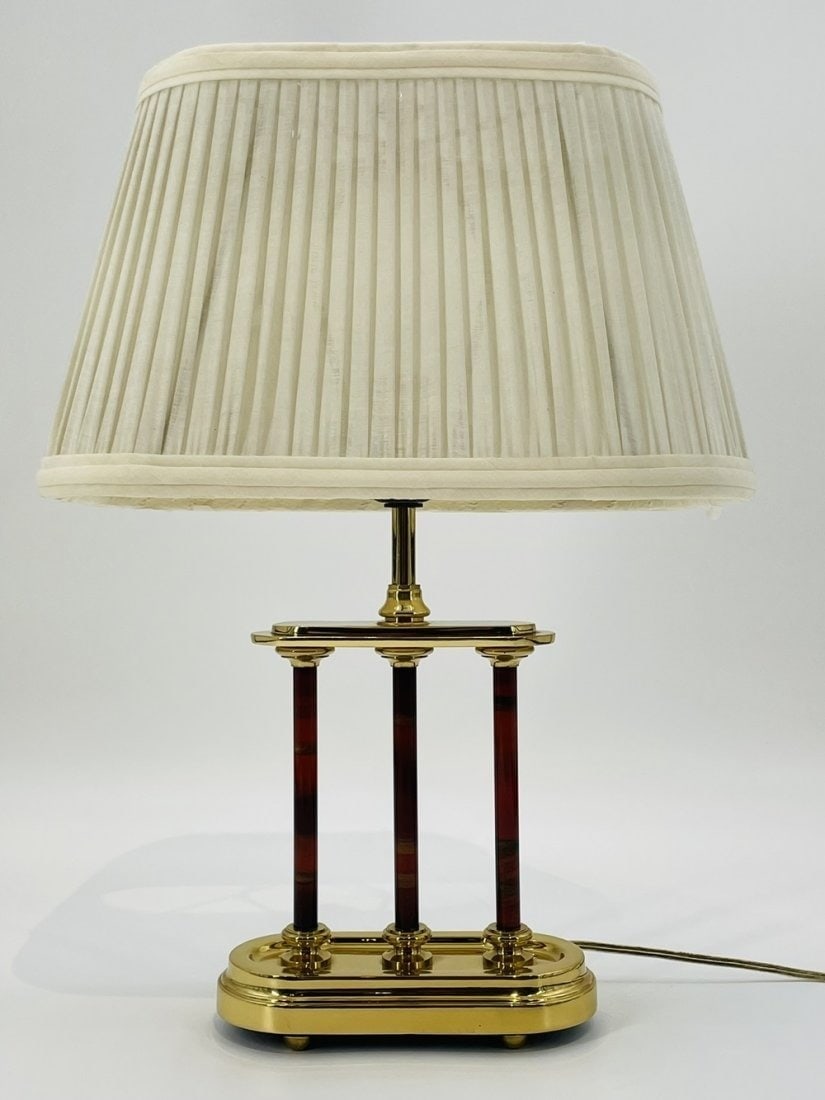 Vintage Brass Lamp Made in the USA by Frederick Cooper, 1970s: Vintage table lamp designed and manufactured in the USA by Frederick Cooper, Chicago Illinois. The lamp has a brass body with a cream colored shade. Measurements: 18.50 inches high x 13 inches wide x