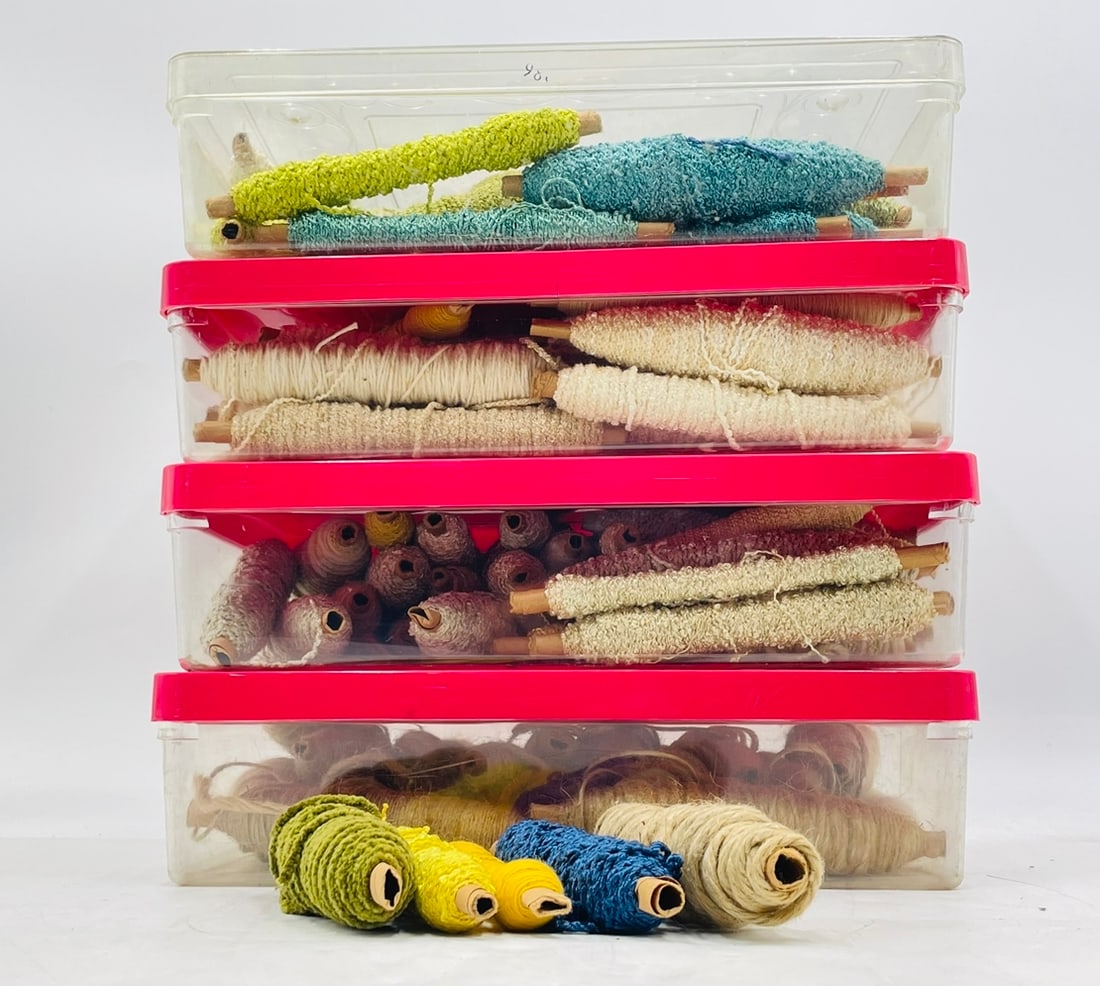 4 Tubs filled with Weaving Threads/Material: 4 plastic tubs filled with weaving material/thread. Different colors, texture and sizes. Each box measures 13.50 inches wide x 10 5/8 inches deep x 3.50 inches high. All items are sold as is. The auct