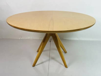 Center Table in the After Osvaldo Borsani: Vintage center table in the style of Osvaldo Borsani. Unmarked. Measurements: 25.50 inches high x 50 inches in diameter. All items are sold as is. The auction house does not warrant authenticity on an