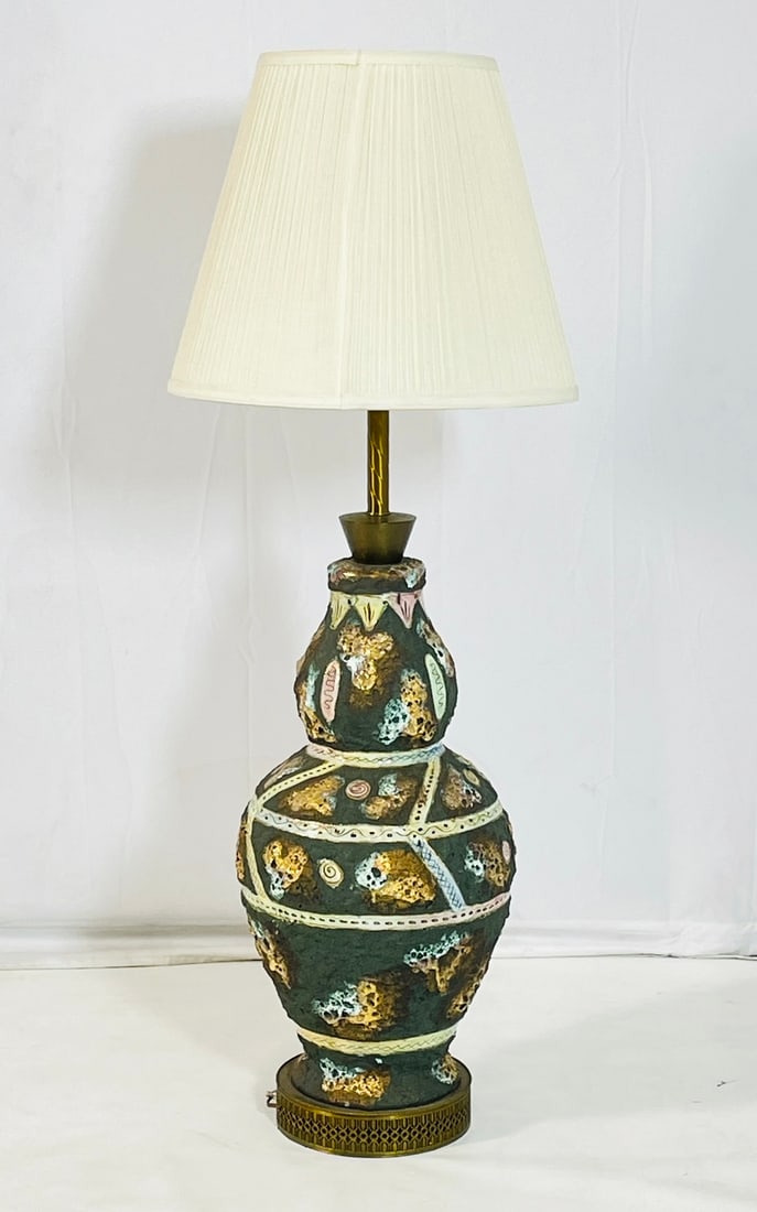 Large Italo Casini Italian Volcanic Lamp: Large vintage table lamp designed and manufactured in Italy by Italo Casini. The lamp has a beautiful volcanic stone finish with geometric patterns. Shade not included. Measurements: 48 inches high x 