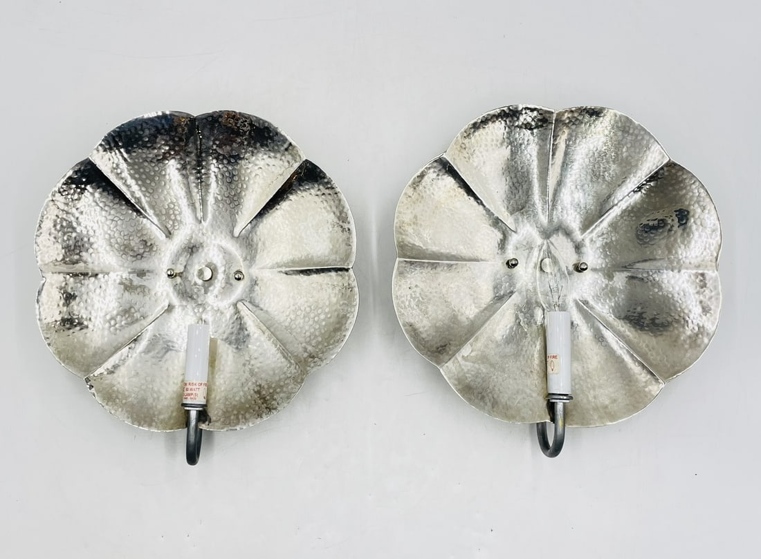 Pair of Scalloped Wall Sconces with Silver Finish by Shades of Light: Pair of wall sconces designed and manufactured in the USA by shades of light. The pieces have a silver finish and a beautiful shape. Measurements: 12.50 inches wide x 14 inches high x 3 inches project
