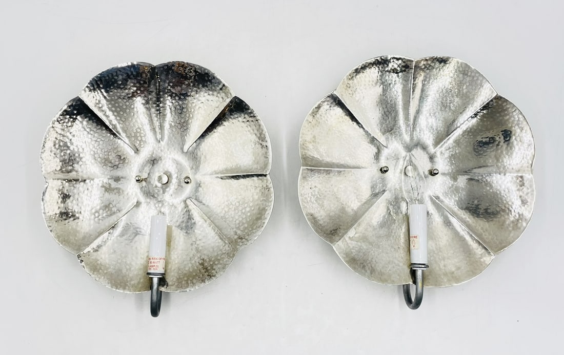 Pair of Scalloped Wall Sconces with Silver Finish by Shades of Light: Pair of wall sconces designed and manufactured in the USA by shades of light. The pieces have a silver finish and a beautiful shape. Measurements: 12.50 inches wide x 14 inches high x 3 inches project