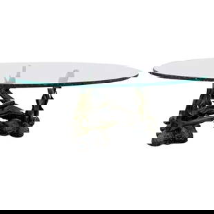 Sculptural Coffee Table, Bronze Sea Scene with a Glass Top: Beautiful bronze and glass coffee table depicting a sea creatures playing around a piece of coral and sea weed leaves, there you can see a couple of fish, snails, clams and a sea star.The bronze has b