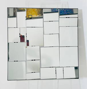 Modern Wall Mirror: Post-Modern wall mirror in the style of Neal Small.Measurements: 24 inches wide x 24 inches high x 1.25 inches deep/projection from the wall. All items are sold as is. The auction house does not warra