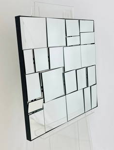 Modern Wall Mirror: Post-Modern wall mirror in the style of Neal Small.Measurements: 24 inches wide x 24 inches high x 1.25 inches deep/projection from the wall. All items are sold as is. The auction house does not warra