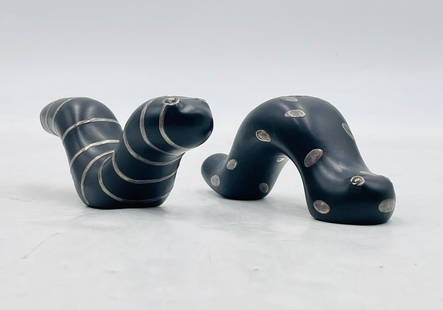 Pair of Emilia Castillo Black Porcelain & Pure Silver Worm Sculptures, Signed, Mexico 1997: A whimsical pair of sculptural salt and pepper shakers by acclaimed Mexican artist Emilia Castillo, crafted in matte black porcelain with pure silver inlay. Each figure takes the form of a playful sty