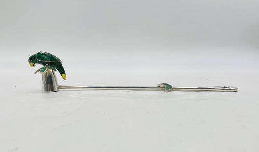 Emilia Castillo Candle Snuffer with Malachite Parrot and Leaf Motif, Mexico 1980's: An exquisite candle snuffer designed by acclaimed Mexican artist Emilia Castillo, handcrafted in silver plate with intricate accents of crushed emerald, malachite, and brass. The handle ends in a deli