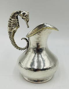 Los Castillo Silver-Plated Seahorse Creamer Pitcher, Taxco Mexico, Mexico 1960s: Charming and collectible silver-plated creamer pitcher by Los Castillo, Taxco, Mexico, featuring a bold and sculptural seahorse-form handle. This handwrought pitcher showcases the studio’s signature