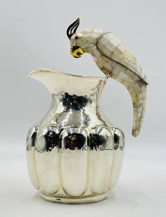 Monumental Los Castillo Parrot Pitcher in Silver Plate & Mother-of-Pearl: Offered here is a rare and monumental parrot-handled pitcher by the iconic Los Castillo of Taxco, Mexico. This sculptural vessel is masterfully handcrafted in silver plate with mother-of-pearl inlay a