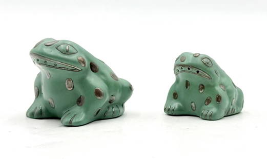 Whimsical Salt & Pepper Shakers in Pure Silver & Porcelain by Emilia Castillo: Bring whimsical charm and collectible artistry to your table with this rare pair of frog-form salt and pepper shakers by renowned Mexican designer Emilia Castillo. Crafted in the 1980s, each shaker is