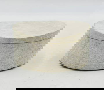 Contemporary Carved Limestone Cotton Jar with Lid: A contemporary round cotton jar crafted from natural limestone, featuring a smooth polished interior and a textured, hand-carved exterior with horizontal tooling. The lid fits snugly into the vessel