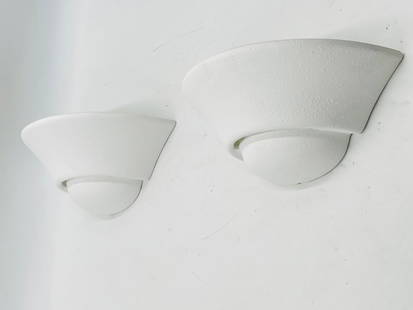 Pair of Modern White Ceramic Wall Sconces: Sleek and minimal pair of white ceramic wall sconces with a textured matte finish. These contemporary light fixtures feature a flared half-dome shape and upward-facing design for a soft, ambient