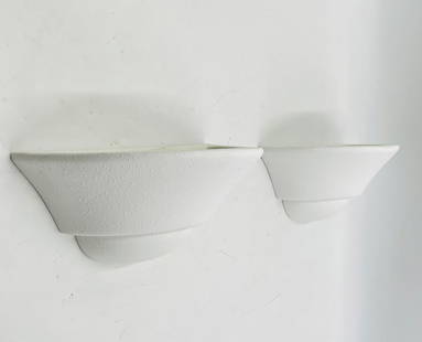 Pair of Modern White Ceramic Wall Sconces: Sleek and minimal pair of white ceramic wall sconces with a textured matte finish. These contemporary light fixtures feature a flared half-dome shape and upward-facing design for a soft, ambient