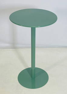 Contemporary Green Metal Bistro Table with Round Top: A sleek and modern bistro table featuring a round metal top in a glossy green finish. The minimalist design includes a single cylindrical pedestal stem and a circular base, providing both visual