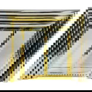 Hollywood Regency Brass and Chrome Fireplace Surround in the Style of Sandro Petti, 1970s: Striking brass and chrome fireplace surround in the bold and glamorous style of Sandro Petti, dating to the 1970s. This Hollywood Regency design features an architectural stepped frame in polished bra