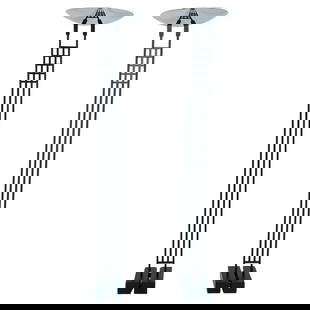 Pair of Floor Lamps/Torchieres by Robert Sonneman for George Kovacs, USA 1987: Pair of Floor Lamps/Torchieres by Robert Sonneman for George Kovacs, crafted in the USA in 1987. These sleek and modern lamps feature a striking black metal base and elegant stainless steel round shad