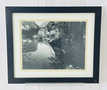 Framed Yosemite Reflection Landscape Photograph by Bob Werling: Elegant black and white photograph by acclaimed American photographer Bob Werling, capturing a serene Yosemite wilderness scene. The image features a glassy lake reflecting surrounding trees, granite