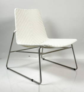 Contemporary White Woven Lounge Chair with Stainless Steel Frame: Contemporary white lounge chair featuring a sleek stainless steel frame and a woven synthetic rattan seat and backrest in a crisp white finish. The seat is shaped for ergonomic comfort and showcases a