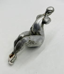 Reclining Nude Figurative Sculpture by Attila Tivadar: A compelling reclining nude sculpture by San Francisco artist Attila Tivadar, crafted in plaster with a hand-applied silver metallic finish. This figurative work captures a female form in a