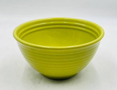 Vintage Bauer Pottery Yellow Ringware Bowl: Vintage glazed ceramic serving or mixing bowl by Bauer Pottery. Features the classic ring ware design with horizontal bands and a bright yellow glaze. Marked “Bauer 9&rdquo; on the underside. A vibr