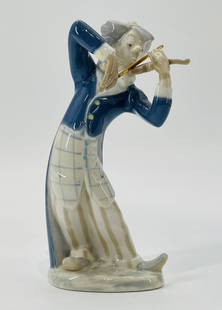 REX Valencia Porcelain Figurine of Violinist, 1969: Vintage porcelain figurine by REX Valencia, Spain, dated 1969. The piece depicts a whimsical violinist mid-performance, hand-painted in a palette of cobalt blue, ivory, and beige with fine detailing o