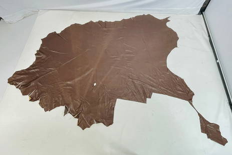 Brown Leather Hide by Conceria Vestena: Brown Leather hide marked Conceria Vestena. Measurements: 110 inches long x 75 inches wide. (all measurements are approximate) All items are sold as is. The auction house does not warrant