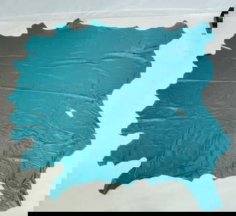 Blue Leather Hide: Blue leather hide, unmarked. Measurements: 98 inches long x 95 inches wide. (all measurements are approximate and to the widest and longest points) All items are sold as is. The auction house does