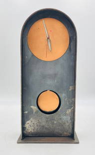Industrial Steel and Copper Mantel/Wall Clock, 19” High: A striking industrial-style mantel or wall clock crafted from steel with contrasting copper face accents. The tall, arched silhouette gives it a sculptural presence, while the raw patina of the steel