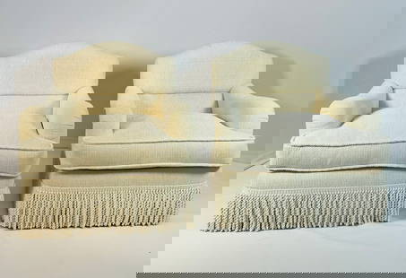Pair of Large Arm Chairs Made in San Francisco by Kroll Furniture: Beautiful pair of lounge chairs with exaggerated curves and a fringe all around the chair frame. The chairs were designed and manufactured in San Francisco California by Kroll Furniture as per