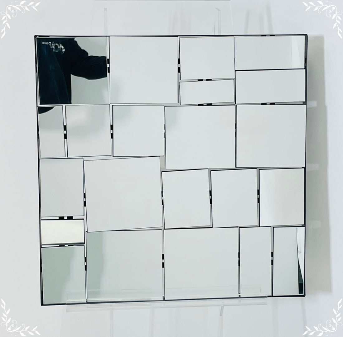 Sculptural Postmodern Mirror with Layered Panels: Striking postmodern wall mirror featuring a geometric mosaic of raised mirrored panels arranged at varying depths. Reminiscent of designs by Neal Small, this piece creates a bold three-dimensional eff