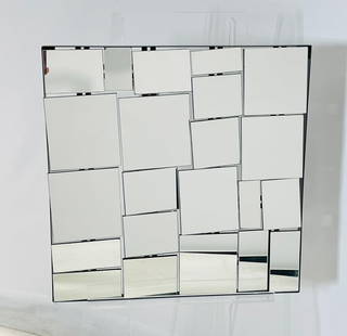 Fragmented Glass Wall Mirror, Postmodern Design: Striking postmodern wall mirror featuring a geometric mosaic of raised mirrored panels arranged at varying depths. Reminiscent of designs by Neal Small, this piece creates a bold three-dimensional eff