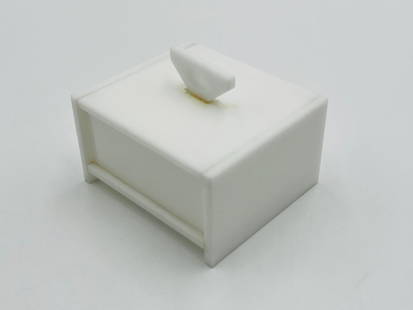 Vintage Jewelry Box in White Lucite in the style of Charles Hollis Jones: Vintage jewelry box in white Lucite styled after Charles Hollis Jones. Measurements: 4 inches wide x 3.50 inches deep x 3 inches high including handle. All items are sold as is. The auction house