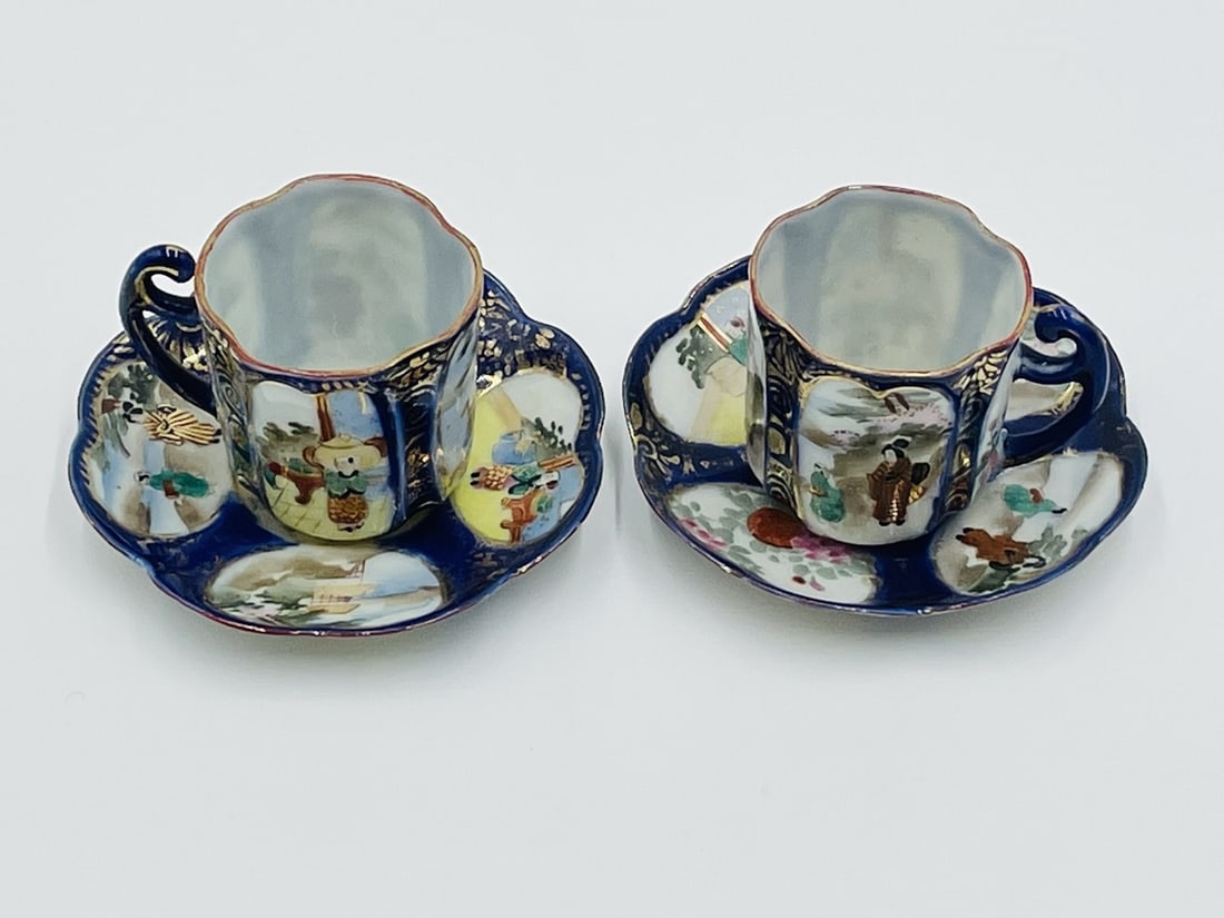 Pair of Imari style Tea Cups and Saucers: This stunning pair of tea cups and saucers are painted in rich Imari style tones and colors, Delicate to the touch and exquisite detail.The pieces are marked at the bottom as shown in the images.Measu