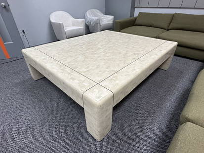 Monumental Coffee Table in Tessellated Stone & Brass by Karl Springer, Signed: Monumental coffee table in tessellated stone and brass inlay designed by Karl Springer. The table has a rectangular shape with a brass inlay on block legs. The table is signed to the underside. Measur