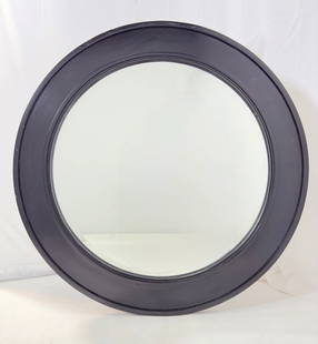 Contemporary Round Wall Mirror With Black Wooden Frame: Contemporary round wall mirror with black wooden frame.<br><br>Unmarked.<br><br>Measurements: 42.25 inches in diameter x 1.50 inches deep/projection from the wall. <br>&l