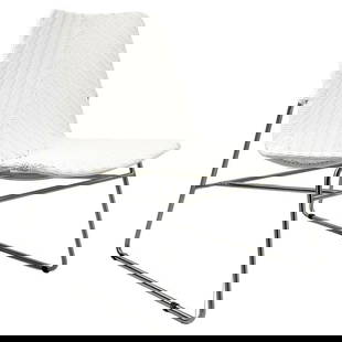 Modern Chair with Chromed Frame and Faux Wicker Seat: Beautiful chair with clean lines, chromed frame a faux wicker seat. The chair is very comfortable and it can be used indoors or outdoors. Measurements: 31 inches high x 22 inches wide x 29 inches deep