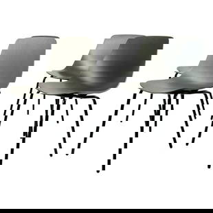 Set of Four Modern Chairs with Molded Seats and Black Metal Frames: Set of four modern chairs having a molded plywood seat and metal legs with a black powder-coat finish. Measurements: 31 inches high x 18 3/8 inches wide x 18 3/4 inches deep x 17.50 inches seat