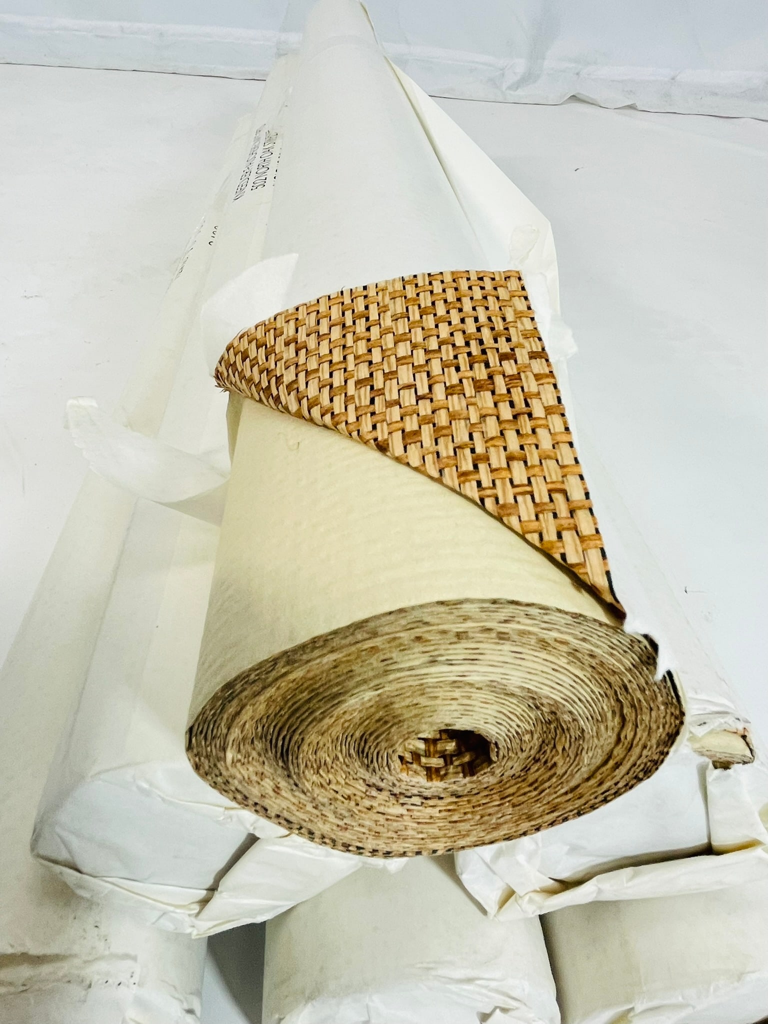 Set of 6 Rolls of Raffia Wall Covering by Gregorius Pineo for Kneedler-Fauchere, PB-135: Set of 6 rolls of 2 tone raffia wall covering/wall paper designed by Gregorius Pineo and manufactured in Japan by Kneedler-Fauchere. Large basket-weave deign item # PB-135 Run #2466 All of the rolls a