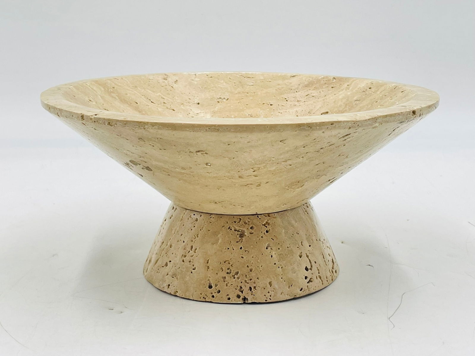 "Lubo" Travertine Pedestal Bowl by Currey Company: The Lubo Travertine Small Bowl is made of Travertine, which has a swirling personality as fluid as the shifting sands of the desert. The tan footed bowl will be a chameleon in an interior, as it will