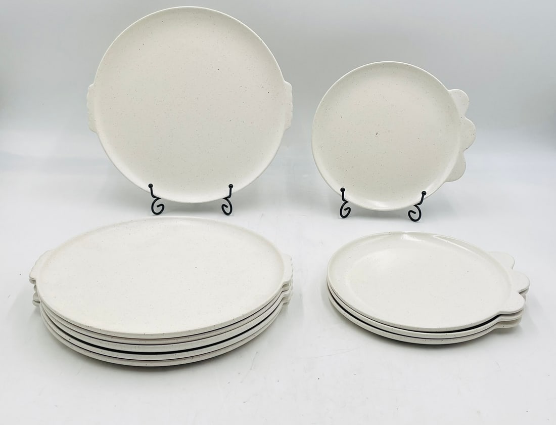 Set of 10 SSS x LG White Speckled Stoneware Plates: Minimalist stoneware plate set by SSS ? LG. Includes 6 large dinner plates and 4 smaller side plates. Subtle off-white glaze with natural brown speckling and sculptural tab handles. Dishwasher and mic
