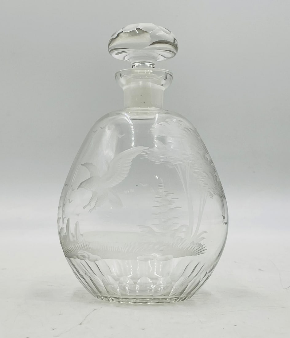 Etched Crystal Glass Decanter with Stopper ? Nature Scene Motif: Elegant hand-etched crystal glass decanter featuring a detailed naturalistic scene with birds in flight, trees, and foliage. The bulbous body is adorned with a delicately frosted landscape that wraps