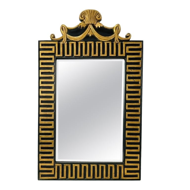 Monumental Neoclassical Style Mirror with Greek Key and Shell Crest in Black and Gold: Striking neoclassical-style wall mirror featuring an architectural black and gold Greek key border and an ornate crest with a classical shell and draped ribbon motif. The bold contrast of gilt detaili