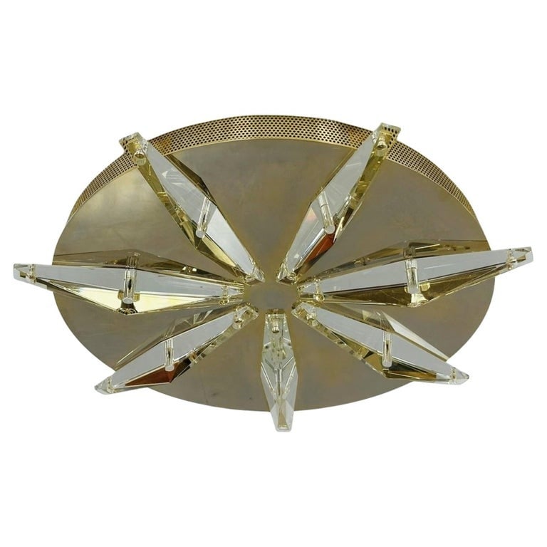 Hollywood Regency Style Coffee Table in Giltwood & Antique Mirror: Large ceiling or Wall light designed and manufactured in Italy.The piece is very stunning, the faceted crystal pieces reflect the light Beautifully.This light came out of the home that Jennifer Lopez