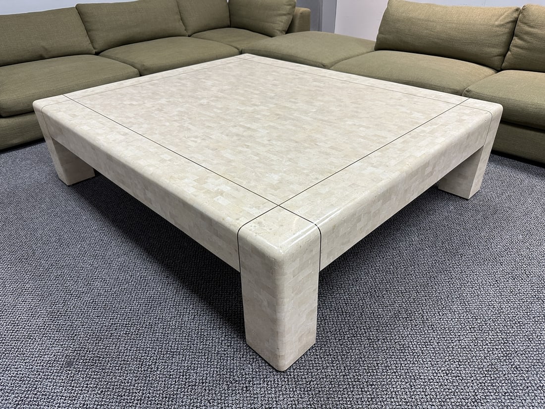 Monumental Coffee Table in Tessellated Stone & Brass by Karl Springer, Signed: Monumental coffee table in tessellated stone and brass inlay designed by Karl Springer. The table has a rectangular shape with a brass inlay on block legs. The table is signed to the underside. Measur