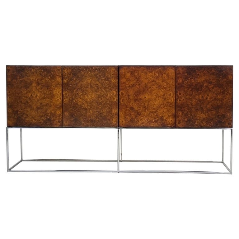 Burlwood & Chrome Sideboard by Milo Baughman for Thayer Coggin: Milo Baughman for Thayer Coggin Burl Wood Sideboard, the rectangular top with burl wood veneer and four hinged panel doors opening to a fitted interior, raised on a squared chrome base. Dimensions: 34