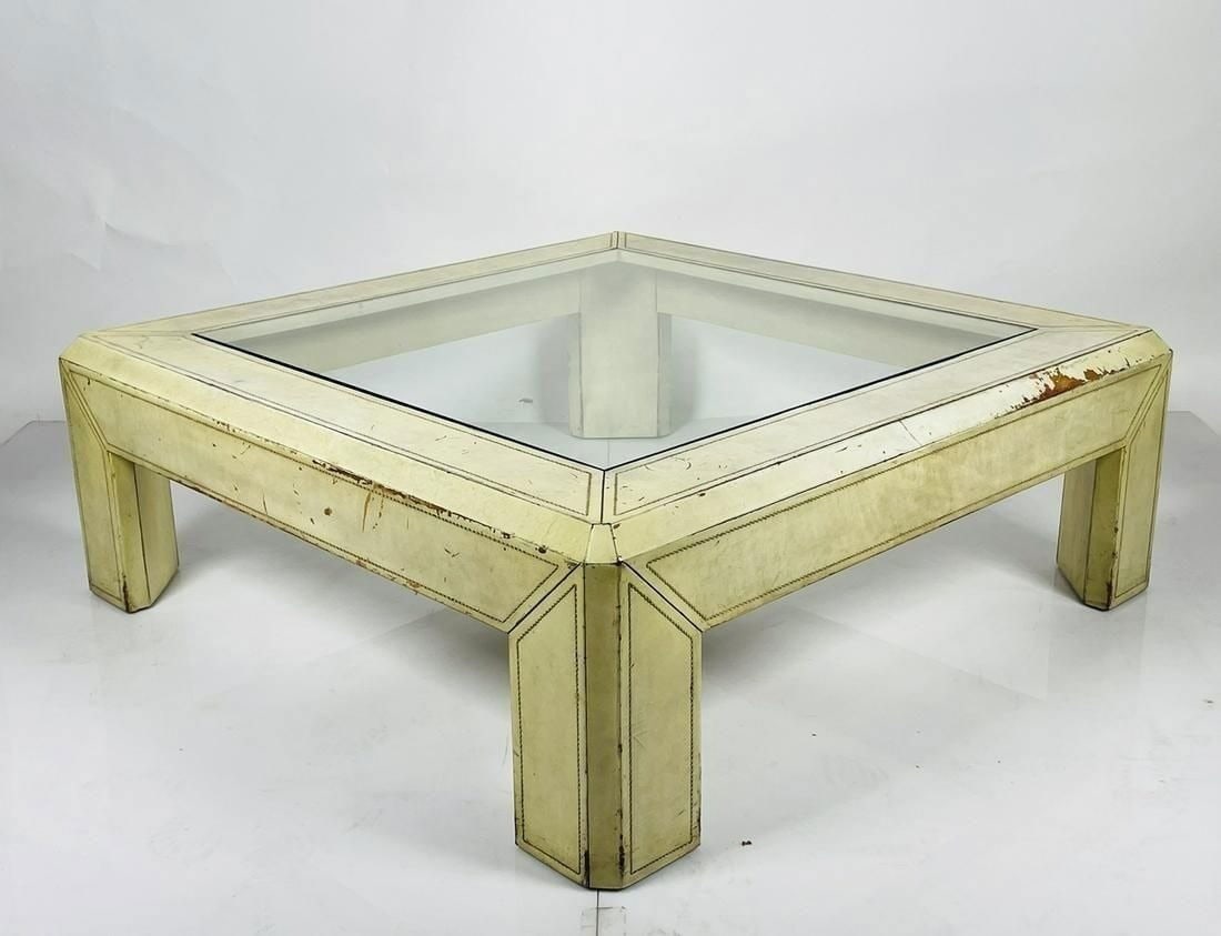 Beautiful and large coffee table embossed in leather in the style of Karl Springer.: Beautiful and large coffee table embossed in leather in the style of Karl Springer.Measurements:48 inches square x 16.75 inches high.All items are sold as is. The auction house does not warrant authen
