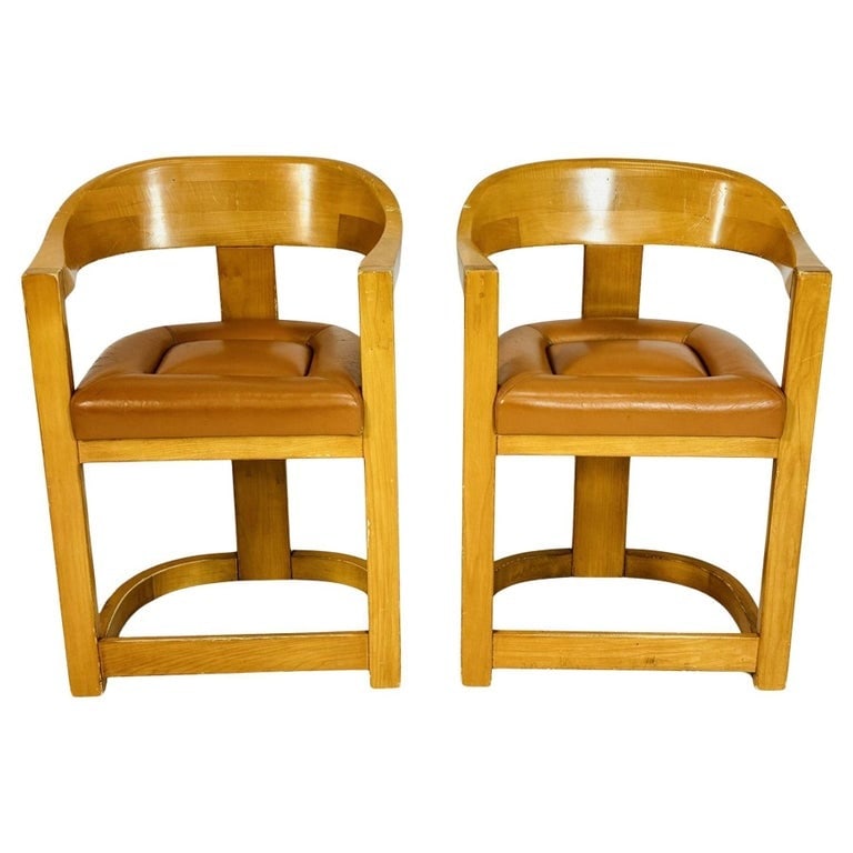 Pair of Onassis Counter Stools After Karl Springer: Pair of Onassis counter stools in the style of Karl Springer.The stools are made in solid wood and upholstered in a brown leather.The stools are unmarked.Measurements: